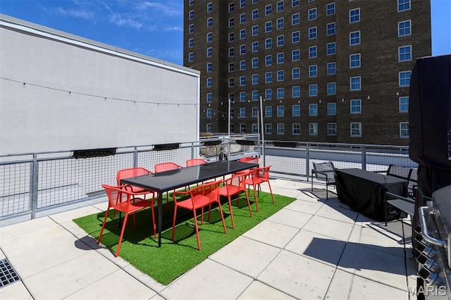 901 Washington Ave Unit 411, Saint Louis, MO 63101 - view of patio / terrace with outdoor dining area and fence