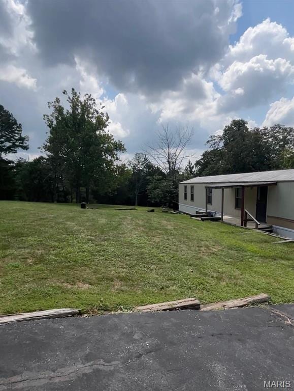 5904 Kneff Rd, Imperial, MO 63052 - view of green lawn featuring entry steps