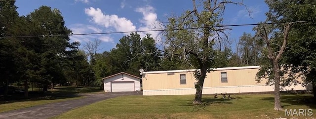 5904 Kneff Rd, Imperial, MO 63052 - manufactured / mobile home with a detached garage, an outdoor structure, and a front lawn