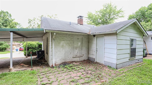view of outbuilding featuring a carport