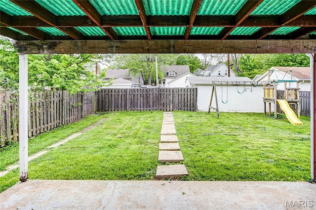 1404 Lemon St, Highland, IL 62249 - fenced backyard featuring a playground