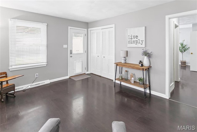1404 Lemon St, Highland, IL 62249 - entrance foyer featuring wood finished floors and a baseboard heating unit