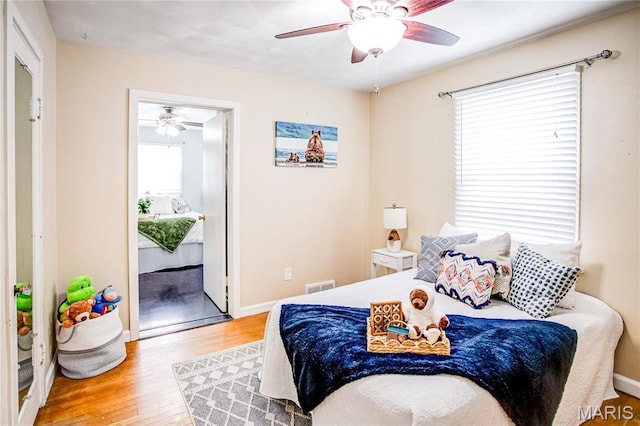 1404 Lemon St, Highland, IL 62249 - bedroom with wood finished floors and a ceiling fan