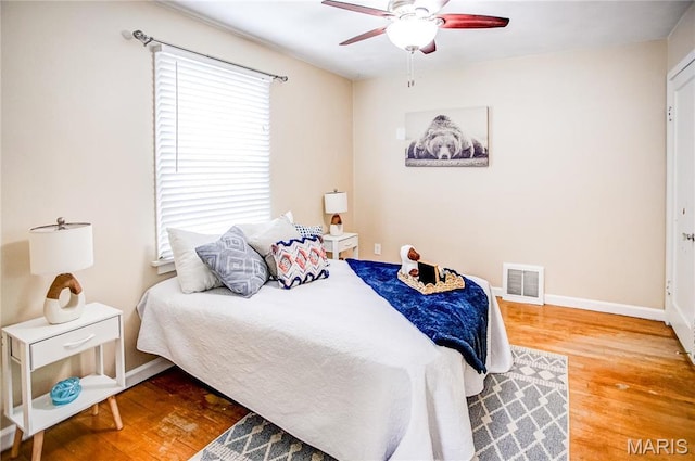 1404 Lemon St, Highland, IL 62249 - bedroom with wood finished floors and a ceiling fan