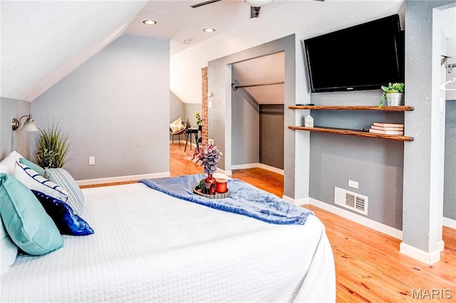 1404 Lemon St, Highland, IL 62249 - bedroom with vaulted ceiling, wood finished floors, a ceiling fan, and recessed lighting