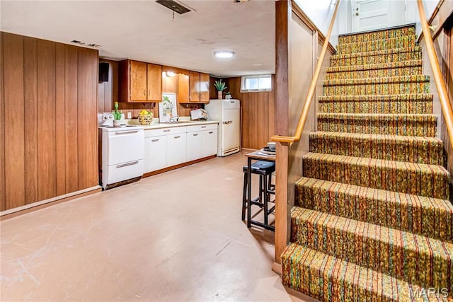 1404 Lemon St, Highland, IL 62249 - stairs with wooden walls and concrete flooring