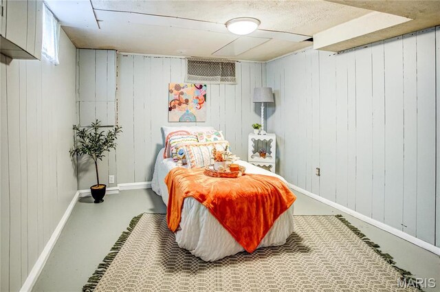 1404 Lemon St, Highland, IL 62249 - bedroom with concrete flooring and wooden walls