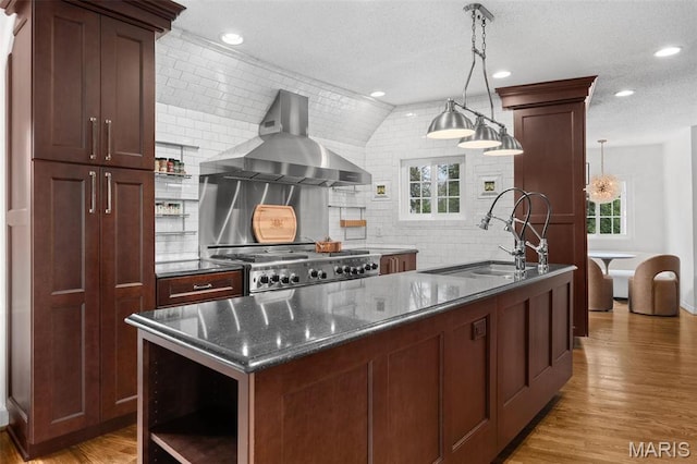2 Northcote Rd, Saint Louis, MO 63144 - kitchen with wall chimney exhaust hood, a sink, light wood-style flooring, tasteful backsplash, and recessed lighting