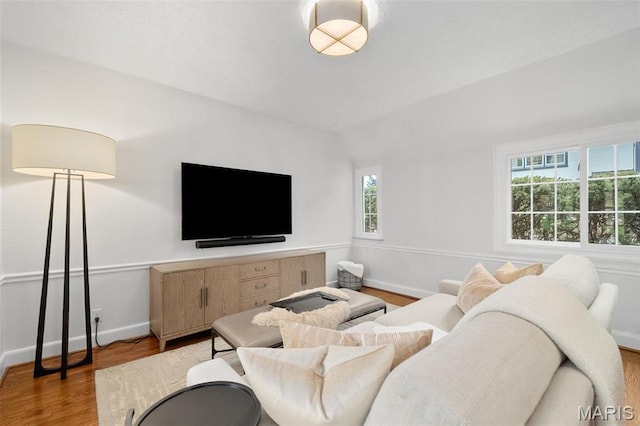 2 Northcote Rd, Saint Louis, MO 63144 - living area featuring vaulted ceiling, wood finished floors, and baseboards