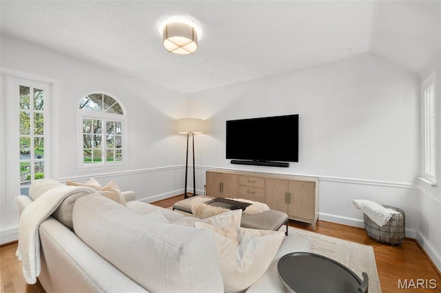 2 Northcote Rd, Saint Louis, MO 63144 - living room with wood finished floors, baseboards, and lofted ceiling