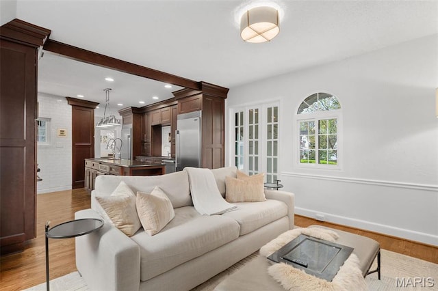 2 Northcote Rd, Saint Louis, MO 63144 - living area featuring light wood-type flooring, baseboards, and recessed lighting