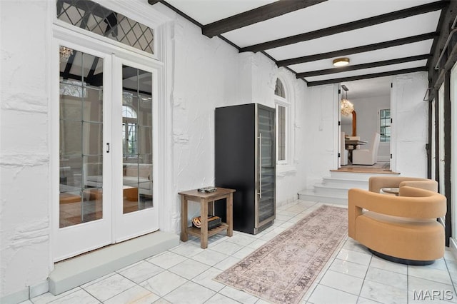 2 Northcote Rd, Saint Louis, MO 63144 - tiled living area featuring french doors, beamed ceiling, and a textured wall