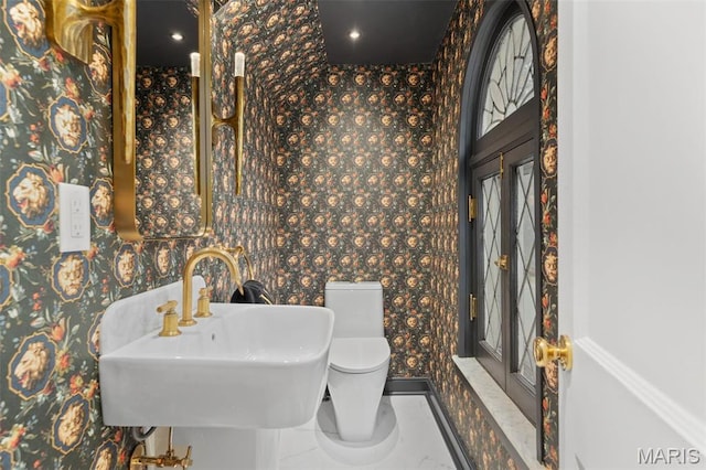 2 Northcote Rd, Saint Louis, MO 63144 - bathroom featuring wallpapered walls, a sink, and toilet