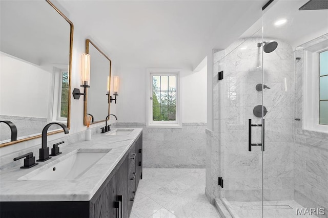 2 Northcote Rd, Saint Louis, MO 63144 - full bath with tile walls, double vanity, a stall shower, and wainscoting