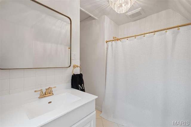 2 Northcote Rd, Saint Louis, MO 63144 - full bath with vanity, backsplash, curtained shower, a chandelier, and tile walls