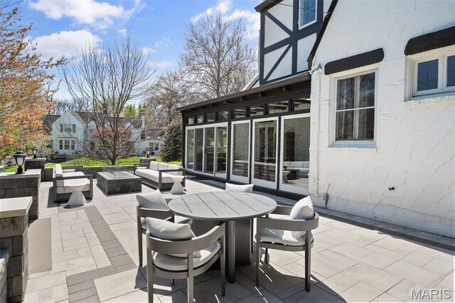 2 Northcote Rd, Saint Louis, MO 63144 - view of patio with an outdoor living space with a fire pit and outdoor dining area