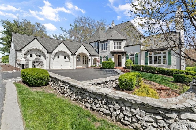 2 Northcote Rd, Saint Louis, MO 63144 - french country inspired facade with asphalt driveway, a high end roof, and stone siding