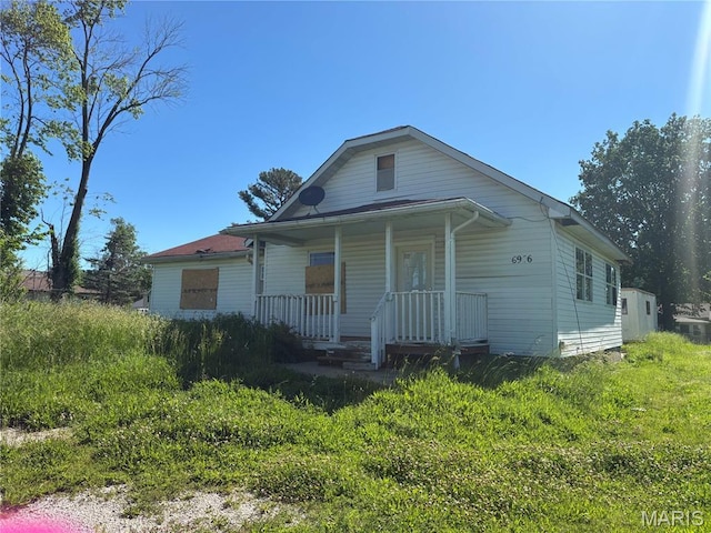 6966 Front St, Barnhart, MO 63012 - bungalow-style house with covered porch