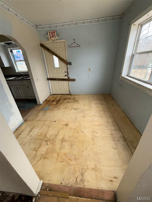 6966 Front St, Barnhart, MO 63012 - unfurnished living room with arched walkways