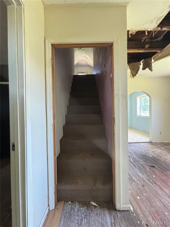 6966 Front St, Barnhart, MO 63012 - stairs featuring arched walkways and wood finished floors