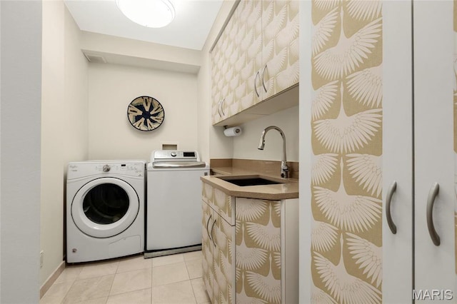900 S Hanley Rd Unit 15E, Clayton, MO 63105 - clothes washing area featuring washing machine and clothes dryer, light tile patterned floors, wet bar, and cabinet space
