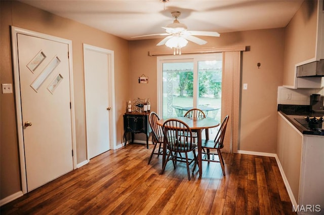 dining area with ceiling fan, wood finished floors, and baseboards