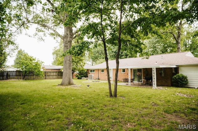 view of yard with a patio and central AC