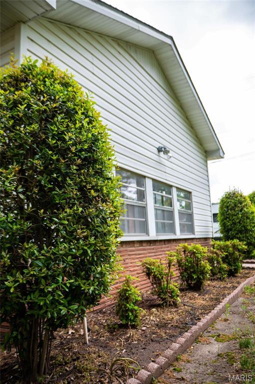 view of side of property with brick siding