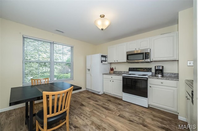 846 Sugar Valley Ct Unit 4, Saint Peters, MO 63376 - kitchen featuring electric range oven, stainless steel microwave, white fridge with ice dispenser, and white cabinets