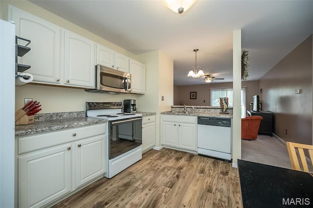 846 Sugar Valley Ct Unit 4, Saint Peters, MO 63376 - kitchen featuring white appliances, a chandelier, white cabinetry, light wood finished floors, and a sink
