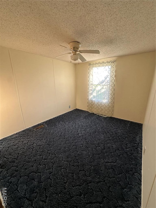 549 E Outer Rd, Sikeston, MO 63801 - unfurnished room featuring a ceiling fan, a textured ceiling, and carpet floors