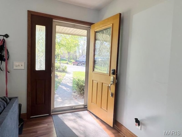 entryway featuring wood finished floors and baseboards