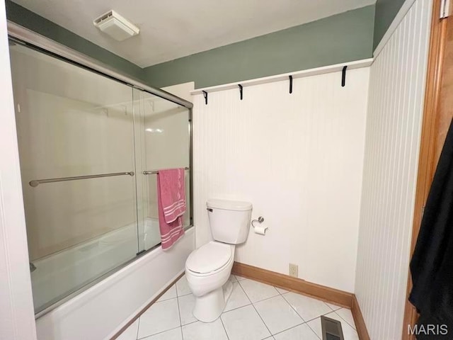 bathroom with enclosed tub / shower combo, toilet, tile patterned floors, and baseboards