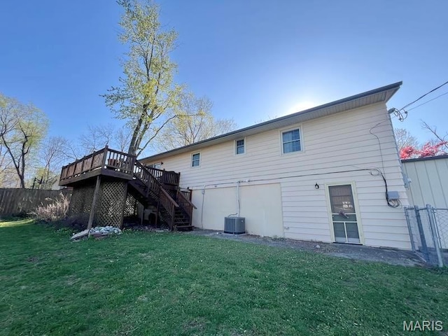 back of property featuring stairway, a deck, and central AC unit