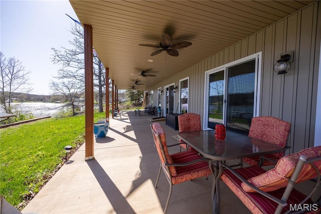 1753 Rue Marseilles, Bonne Terre, MO 63628 - view of patio / terrace with outdoor dining area, ceiling fan, and a water view
