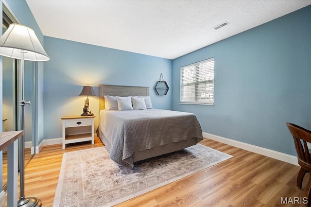 9005 Cardinal Ter, Saint Louis, MO 63144 - bedroom with wood finished floors and baseboards