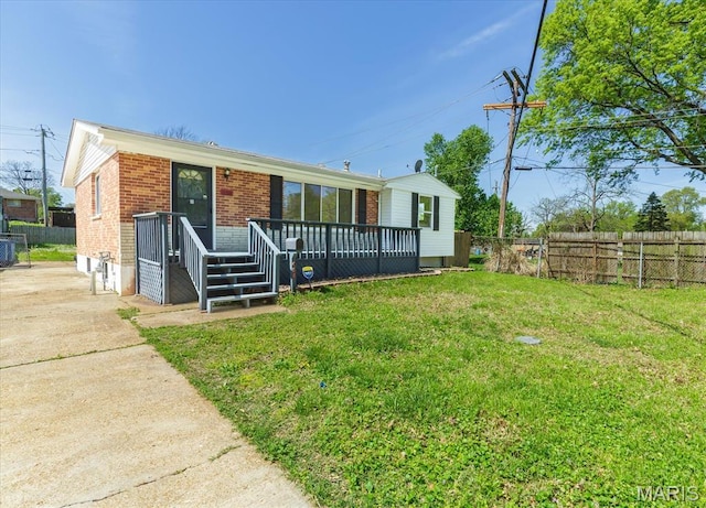 656 Beatrice Ave, Saint Louis, MO 63125 - view of front of house featuring brick siding, a wooden deck, and concrete driveway