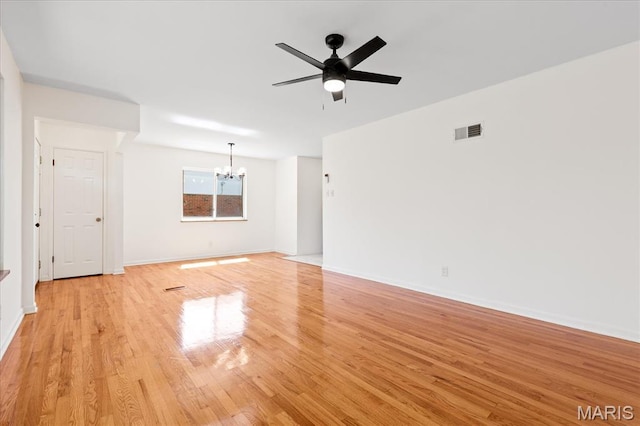 656 Beatrice Ave, Saint Louis, MO 63125 - unfurnished living room featuring a chandelier, light wood-type flooring, ceiling fan, and baseboards