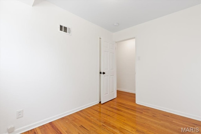 656 Beatrice Ave, Saint Louis, MO 63125 - unfurnished room featuring baseboards and light wood-type flooring