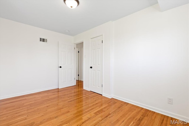656 Beatrice Ave, Saint Louis, MO 63125 - empty room with light wood-style floors and baseboards