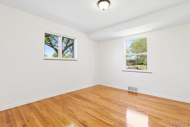 656 Beatrice Ave, Saint Louis, MO 63125 - empty room with baseboards and light wood-type flooring