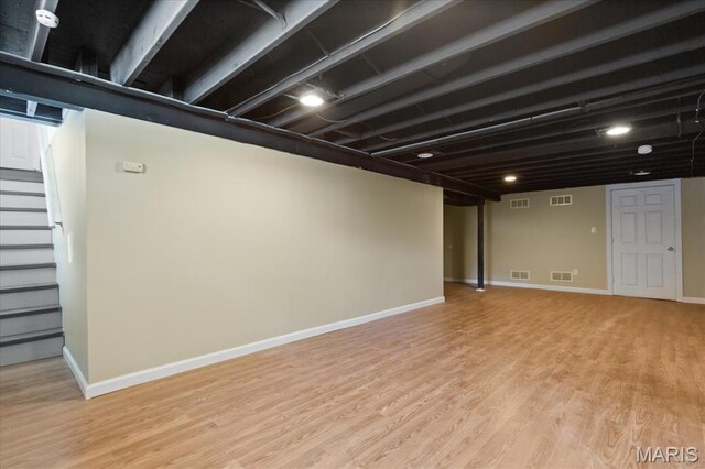 656 Beatrice Ave, Saint Louis, MO 63125 - finished basement featuring light wood-style flooring, stairway, and baseboards