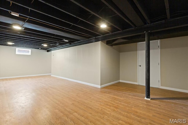 656 Beatrice Ave, Saint Louis, MO 63125 - below grade area with light wood-style floors and baseboards