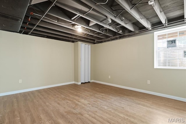 656 Beatrice Ave, Saint Louis, MO 63125 - below grade area featuring wood finished floors and baseboards