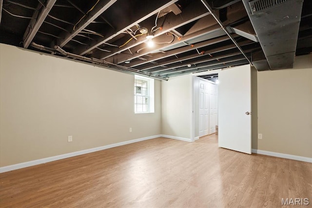 656 Beatrice Ave, Saint Louis, MO 63125 - below grade area with wood finished floors and baseboards