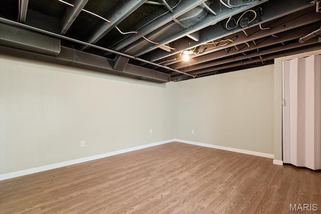 656 Beatrice Ave, Saint Louis, MO 63125 - finished below grade area featuring wood finished floors and baseboards
