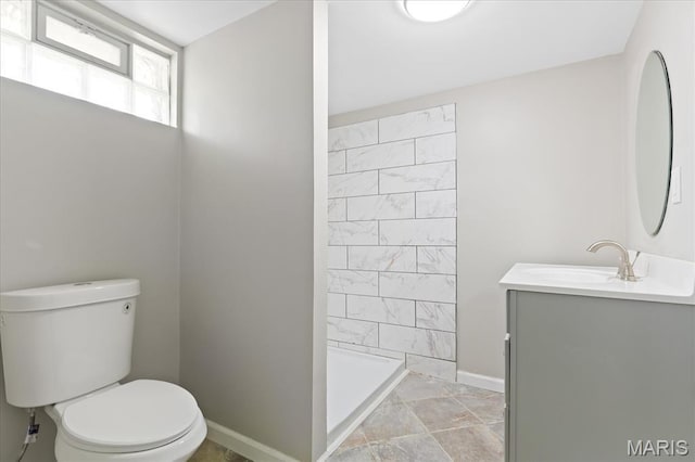 656 Beatrice Ave, Saint Louis, MO 63125 - bathroom with toilet, baseboards, vanity, and a shower stall
