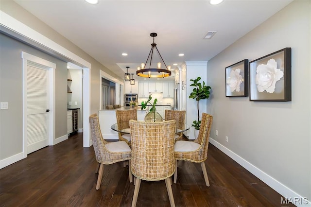 122 N Central Ave Unit A, Saint Louis, MO 63105 - dining area with baseboards, a chandelier, dark wood finished floors, and recessed lighting