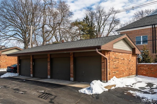 122 N Central Ave Unit A, Saint Louis, MO 63105 - view of snow covered garage