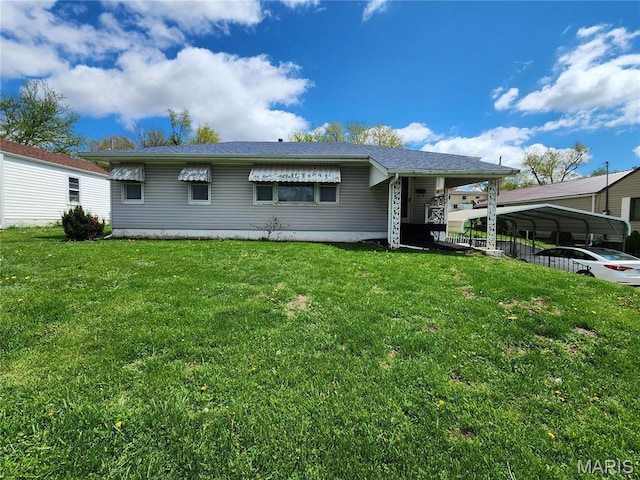 4028 Mcmasters Ave, Hannibal, MO 63401 - view of front of house featuring a front lawn and a detached carport